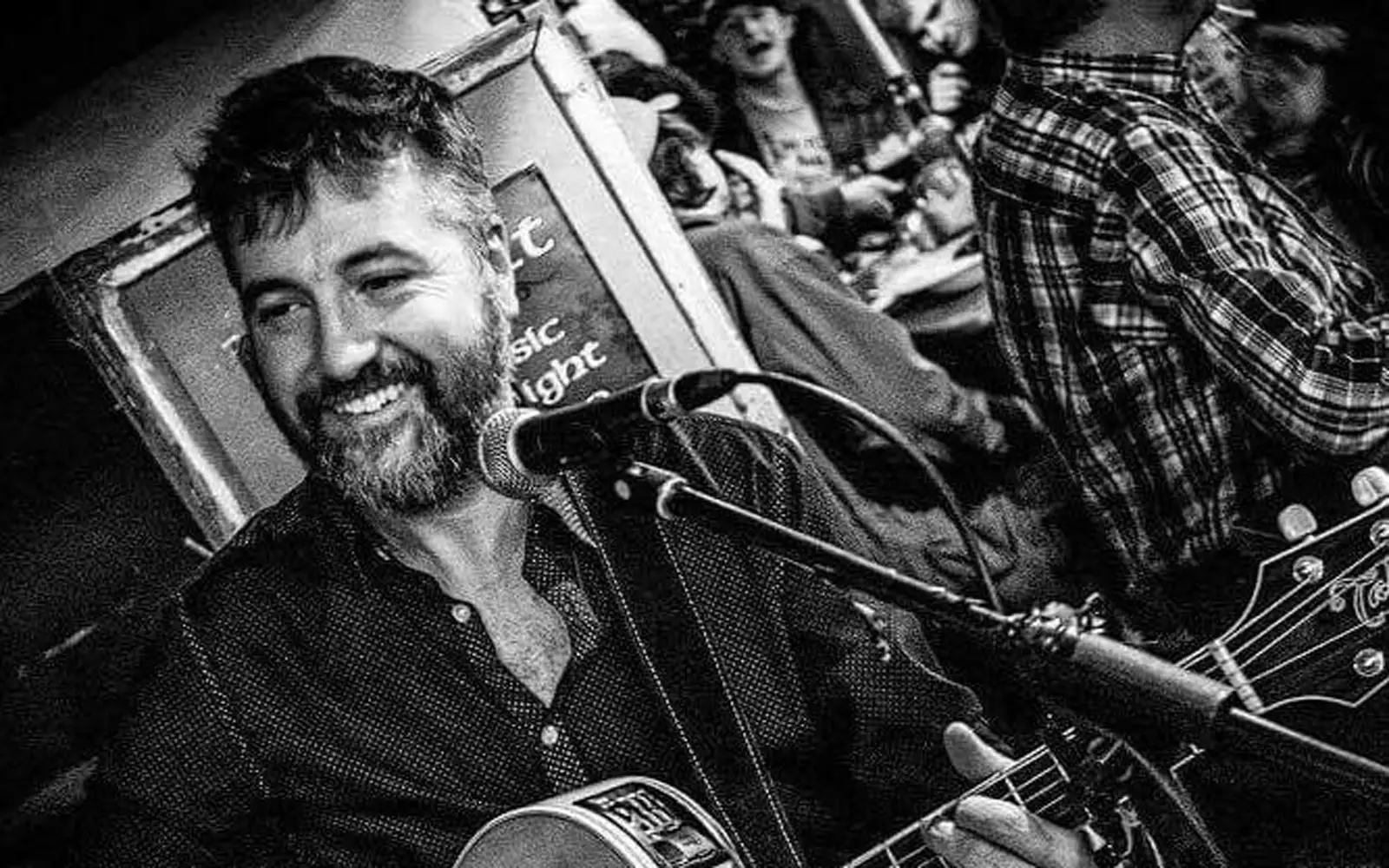 Billy Treacy performing with acoustic guitar - Irish folk singer-songwriter from Dublin